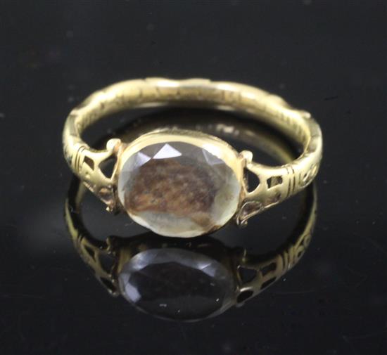 A late 17th century gold, black enamel and Stuart crystal mourning ring, size J.